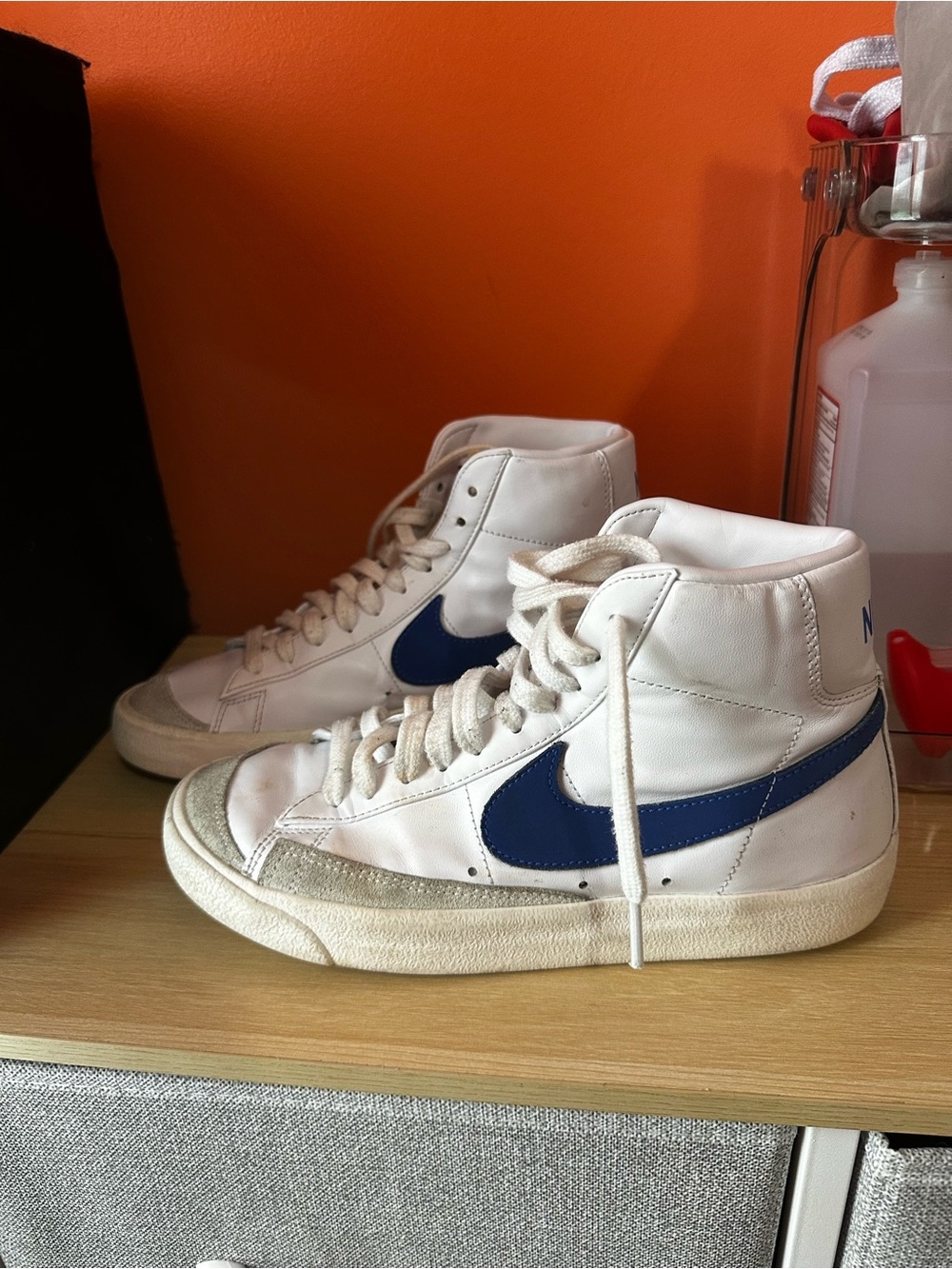Nike Men’s White High-Top Sneakers with Blue Swoosh
